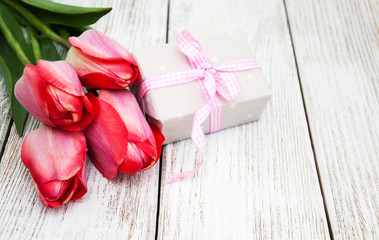 Spring tulips flowers and gift box