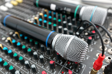Microphone and sound mixer in public area concert stage.