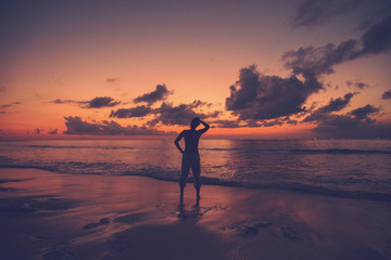 Man enjoying the beautiful sunset on the beach.