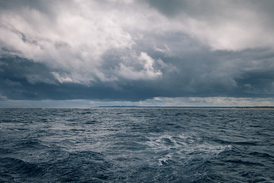 Gloomy weather at sea with rain clouds