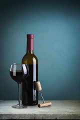 Fototapeta na wymiar Closeup of red wine pouring in glass