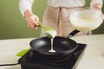 House wife wearing apron making. Steps of making cooking pancake.