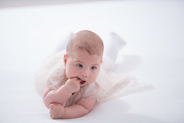 baby on the bed in her room