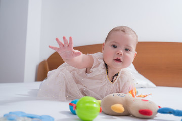 baby on the bed in her room