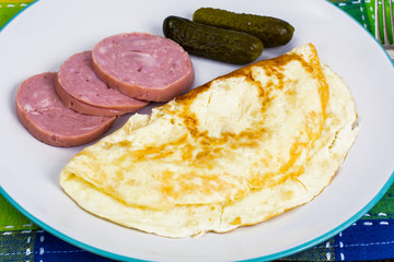 Tasty omelette and chicken ham for breakfast