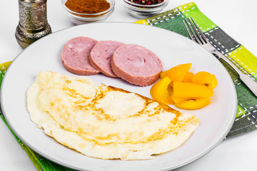 Omelette in plate, sweet yellow pepper