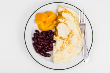 Omelette in plate, sweet yellow pepper