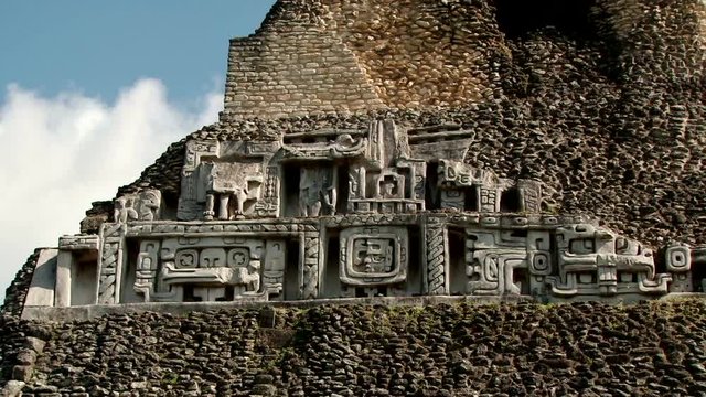 Close shot of carved elements on the top of temple El Castillo at Xunantunich, Belize