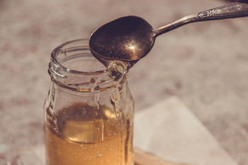 Organic pure honey in jar. Close up