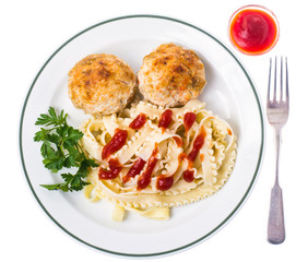 Meat cutlets with pasta and ketchup