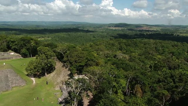 Pan across from right to left from the top of temple El Castillo at Xunantunich archaeological site in Belize