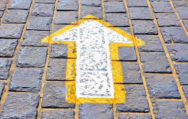 Go straight sign on the brick road