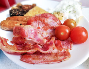 classical english breakfast with egg and fries