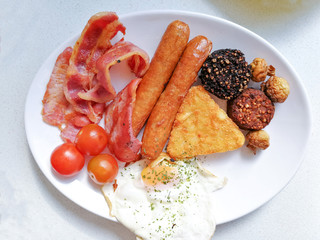 classical english breakfast with egg and fries