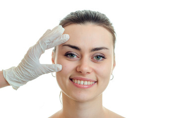 Portrait of a beautiful girl smiling close-up at a doctor