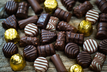 Variety of sweet homemade chocolate pralines and chocolate bars
