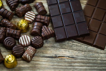 Variety of sweet homemade chocolate pralines and chocolate bars