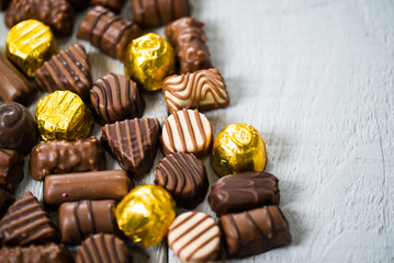 Variety of sweet homemade chocolate pralines and chocolate bars