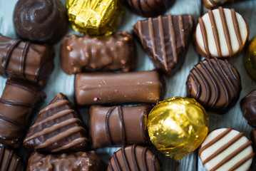 Variety of sweet homemade chocolate pralines and chocolate bars