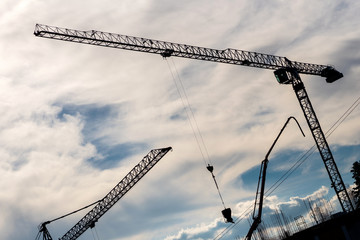 Industrial cranes working on a construction site