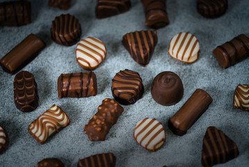 Variety of sweet homemade chocolate pralines and chocolate bars