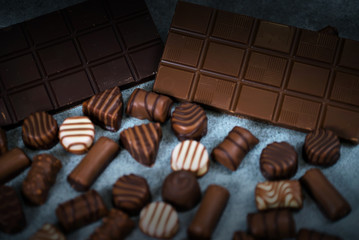 Variety of sweet homemade chocolate pralines and chocolate bars