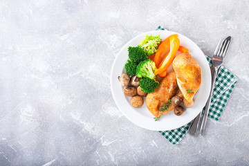 Healthy lunch - chicken fillet, mushrooms, broccoli and paprika. Selective focus. Copy space. Top view