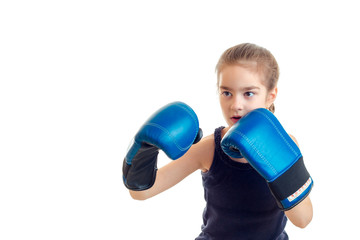 little girl boxer in blue gloves