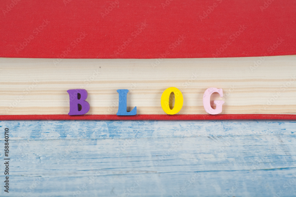 Fototapete blog word on blue background composed from colorful abc alphabet block wooden letters, copy space fo