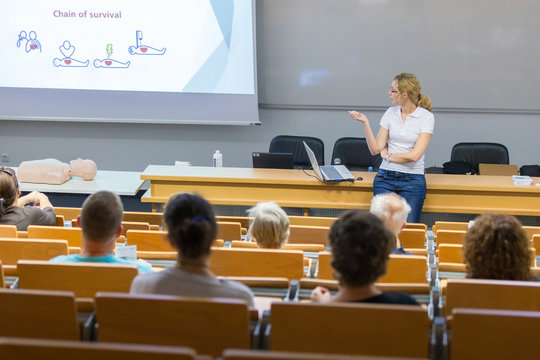 Instructor teaching first aid cardiopulmonary resuscitation course and use of automated external defibrillator on voluntary public workshop for senior people. - Powered by Adobe
