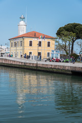 Fototapeta na wymiar Lighthouse and entrance to the port of Cesenatico. Rivera Romagnola