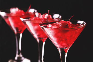 Strawberry daiquiri cocktail with lime, strawberry, cherry and mint