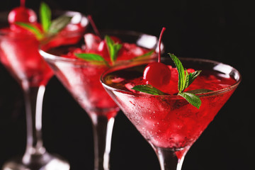 Strawberry daiquiri cocktail with lime, strawberry, cherry and mint