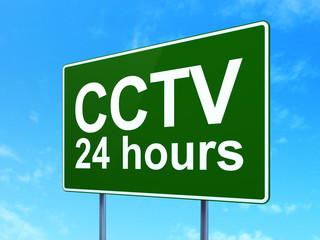 Privacy concept: CCTV 24 hours on road sign background
