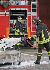 Firefighter training and fire extinguishing with foam and truck