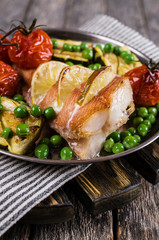 Baked fish with vegetables