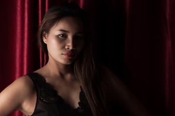 Sexy asian woman in dark room
