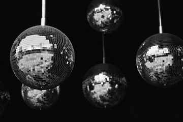 Mirror balls disco party abstract background. Black and white photo. Shallow depth field