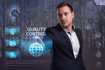 The concept of business, technology, the Internet and the network. A young entrepreneur working on a virtual screen of the future and sees the inscription: Quality control