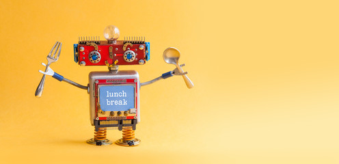 Lunch break concept. Funny robotic toy fork spoon in arms. Retro style cyborg monitor screen with text quote. Yellow background, copy space - 158849137