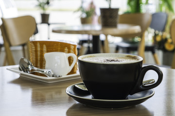 Coffee cup and layercake at coffee shop