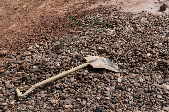 Old Dirty Shovel on heap of dried ground
