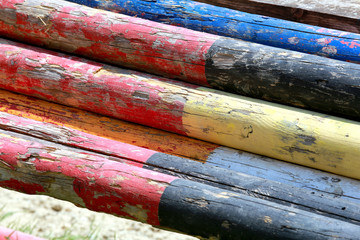 Old colored equitation obstacles bars for horse jumping event