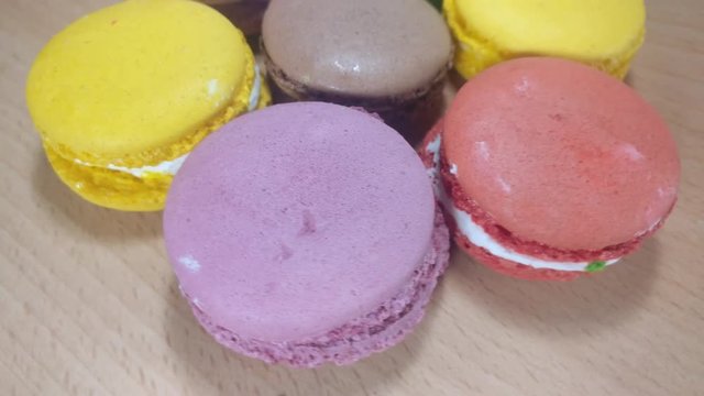 Great background of  macaroons rotating on wooden stand close up. 
Footage will work great for any videos dealing with sweet-shop, childhood, gladness and much more.
