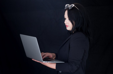 Business woman .Beautiful young business woman with laptop,computer