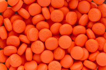 Texture of orange pills