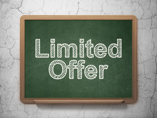 Business concept: Limited Offer on chalkboard background