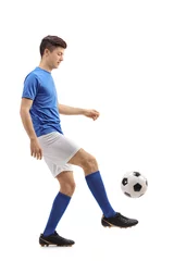 Foto op Plexiglas Teenage soccer player juggling a football © Ljupco Smokovski