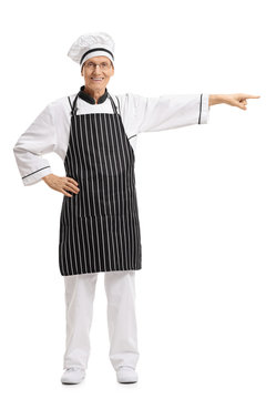 Full length portrait of a chef pointing right