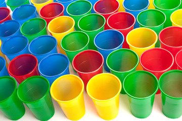 Multicolor plastic glasses isolated on white background